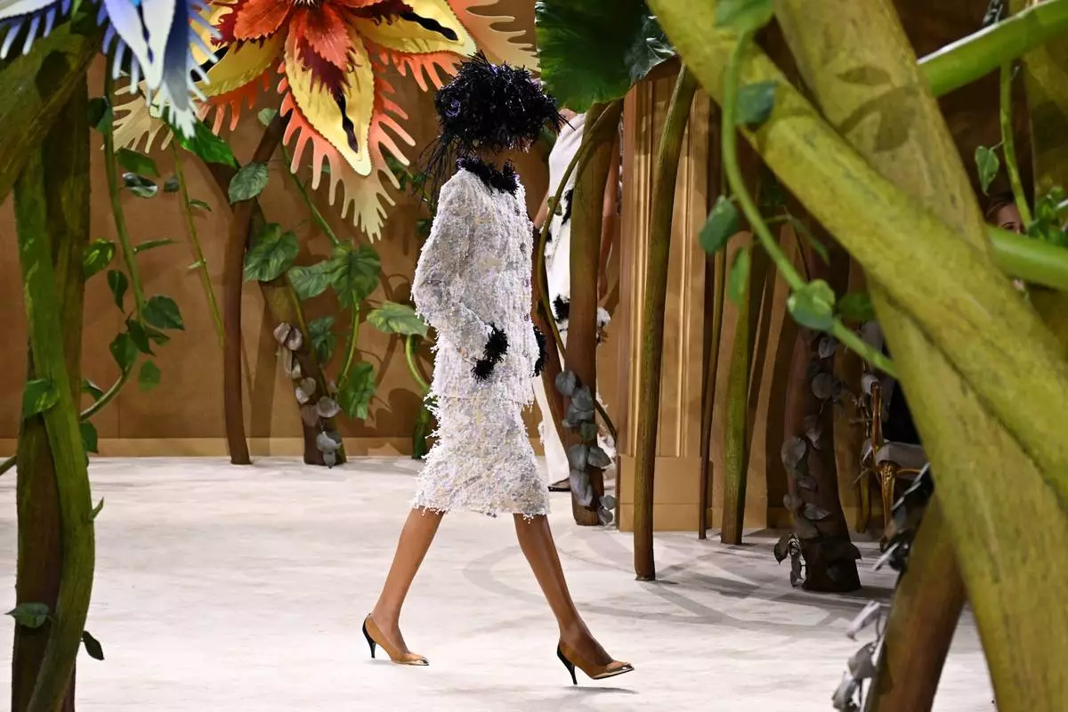 A model wears a creation as part of the Chanel Haute Couture Fall/Winter 2026-2027 Women's collection presented in Paris, Tuesday, July 7, 2026. (AP Photo/Emma Da Silva)
