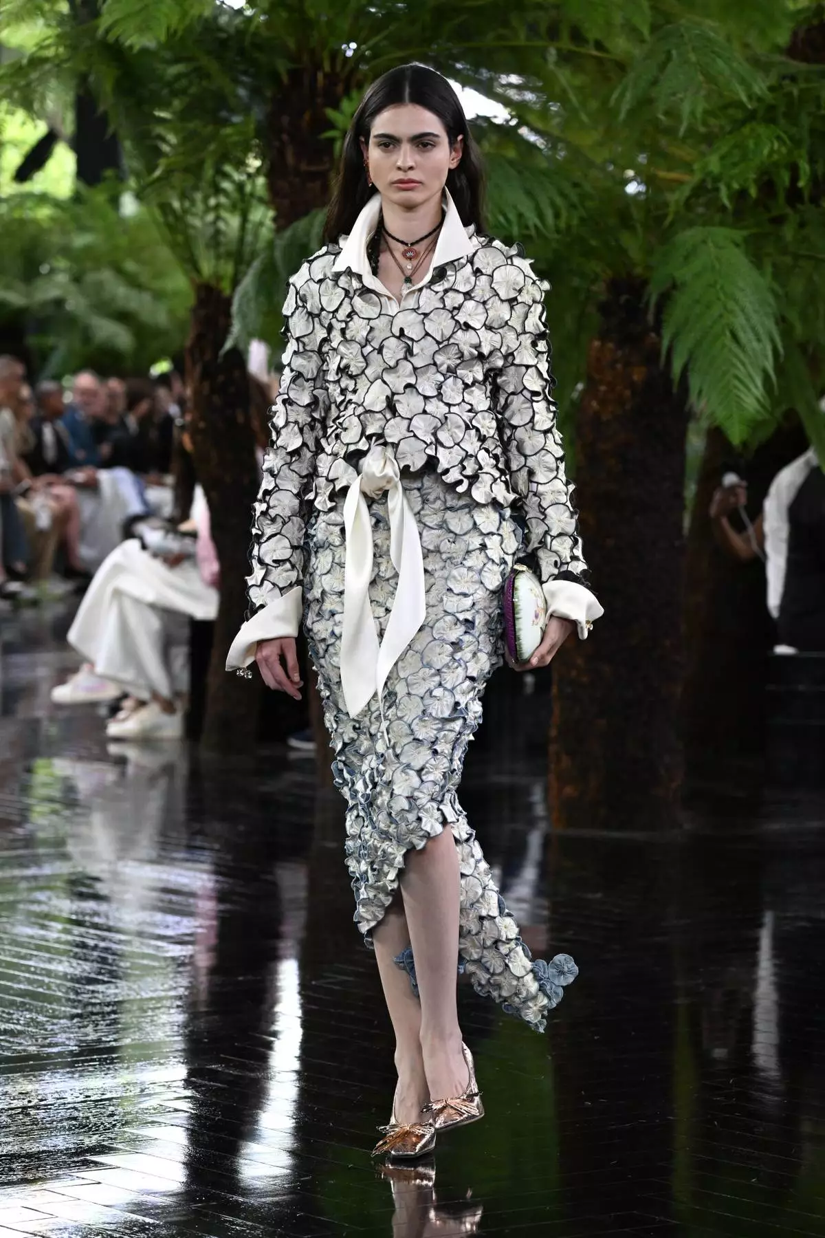 A model wears a creation as part of the Christian Dior Haute Couture Fall/Winter 2026-2027 Women's collection presented in Paris, Monday, July 6, 2026. (AP Photo/Emma Da Silva)
