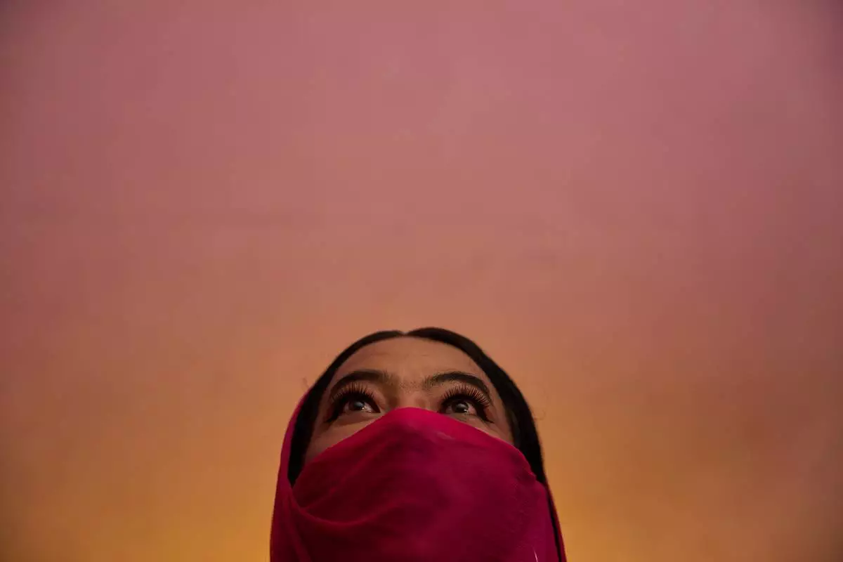 Barsha Magar, a former aid worker who turned to sex work to survive after losing her job amid the U.S. foreign aid cuts, poses for a photo, Sunday, May 17, 2026, in Hetauda, Nepal. Magar spent 16 years as an HIV outreach worker and peer educator for the NGO Friends Hetauda before turning in desperation to sex work, where she has been raped at gunpoint. (AP Photo/Bram Janssen)