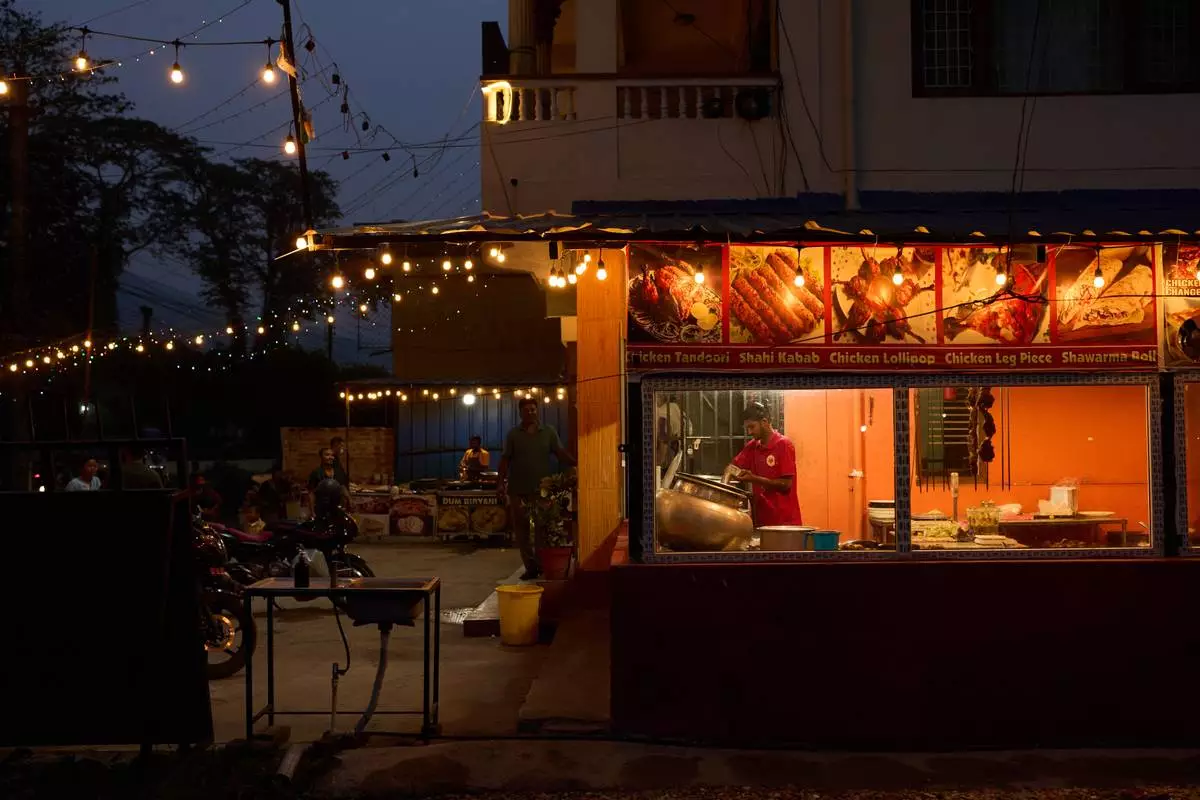 Dusk sets over a restaurant where transgender sex workers meet clients along a busy highway in Hetauda, Nepal, Wednesday, May 20, 2026. (AP Photo/Bram Janssen)