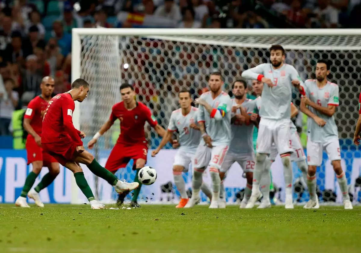 FILE - Portugal's Cristiano Ronaldo kicks to score his side's equalizing goal during the group B World Cup match between against Spain in Sochi, Russia, Friday, June 15, 2018. (AP Photo/Francisco Seco, File)
