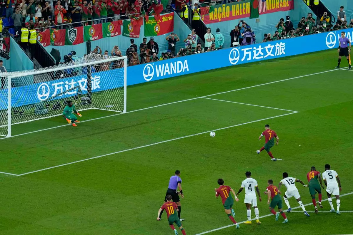 FILE - Portugal's Cristiano Ronaldo scores from the penalty spot during the World Cup group H soccer match against Ghana in Doha, Qatar, Nov. 24, 2022. (AP Photo/Francisco Seco, File)