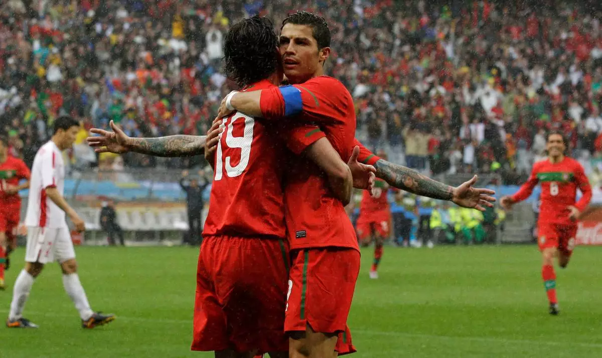 FILE - Portugal's Cristiano Ronaldo celebrates Tiago's goal against North Korea during their World Cup group G soccer match in Cape Town, South Africa, June 21, 2010. (AP Photo/Kin Cheung, File)
