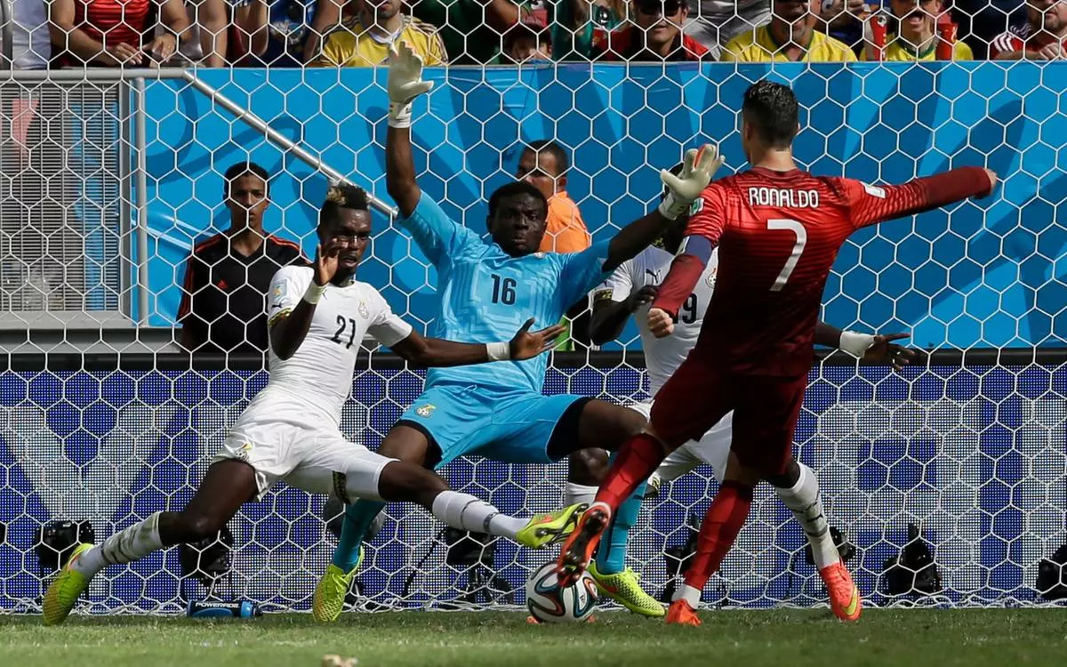 FILE - Portugal's Cristiano Ronaldo scores his team's second goal against Ghana during the group G World Cup soccer match in Brasilia, Brazil, June 26, 2014. (AP Photo/Martin Mejia, File)