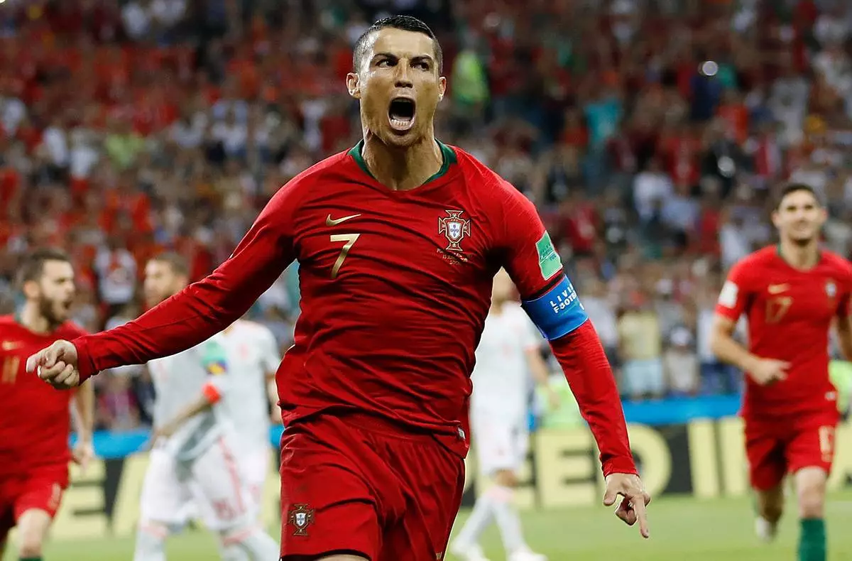FILE - Portugal's Cristiano Ronaldo celebrates his side's opening goal against Spain during the group B match at the World Cup in Sochi, Russia, June 15, 2018. (AP Photo/Francisco Seco, File)