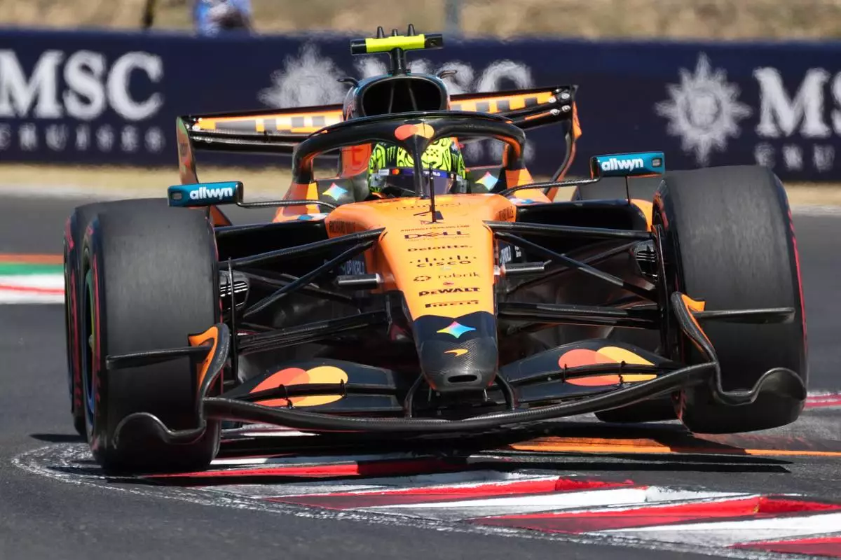 McLaren driver Lando Norris of Britain steers his car during the third free practice ahead of Sunday's Formula One Hungarian Grand Prix auto race, at the Hungaroring racetrack in Mogyorod, near Budapest, Hungary, Saturday, July 25, 2026. (AP Photo/Darko Vojinovic)