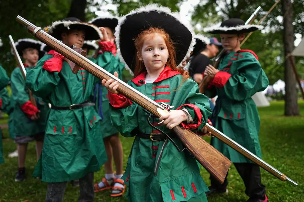 Children attend a historical festival marking the Day of Military Glory in St. Petersburg, Russia, Friday, July 10, 2026. (AP Photo/Dmitri Lovetsky)