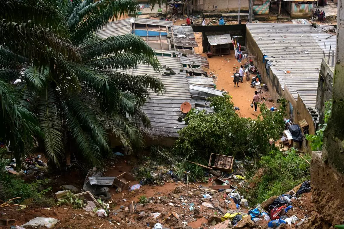 A view of the houses damaged by landslides in an informal settlement of Attecoube, in Abidjan, Ivory Coast, Tuesday, June 30, 2026. (AP Photo/Diomande Ble Blonde)