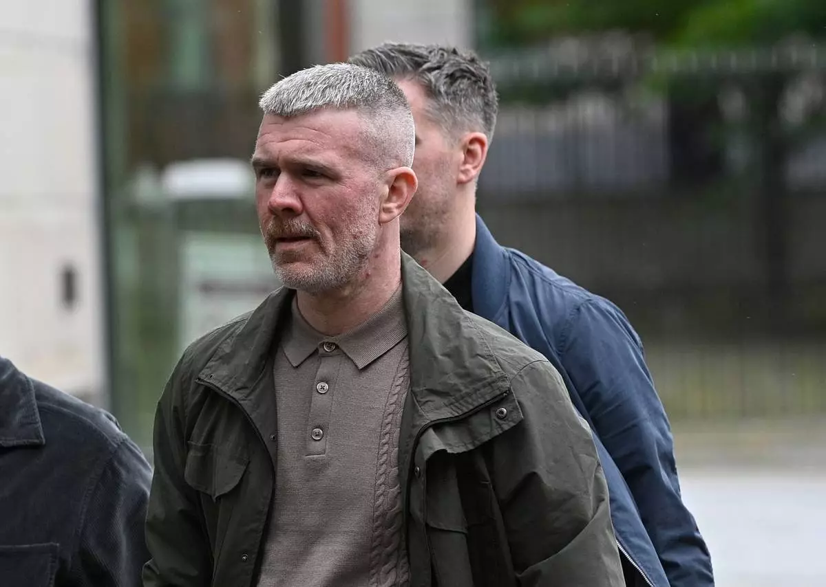 Peter Cavanagh leaves Belfast Crown Court after a non-jury trial of the murder of journalist Lyra McKee, Friday July 3, 2026. (PA via AP)