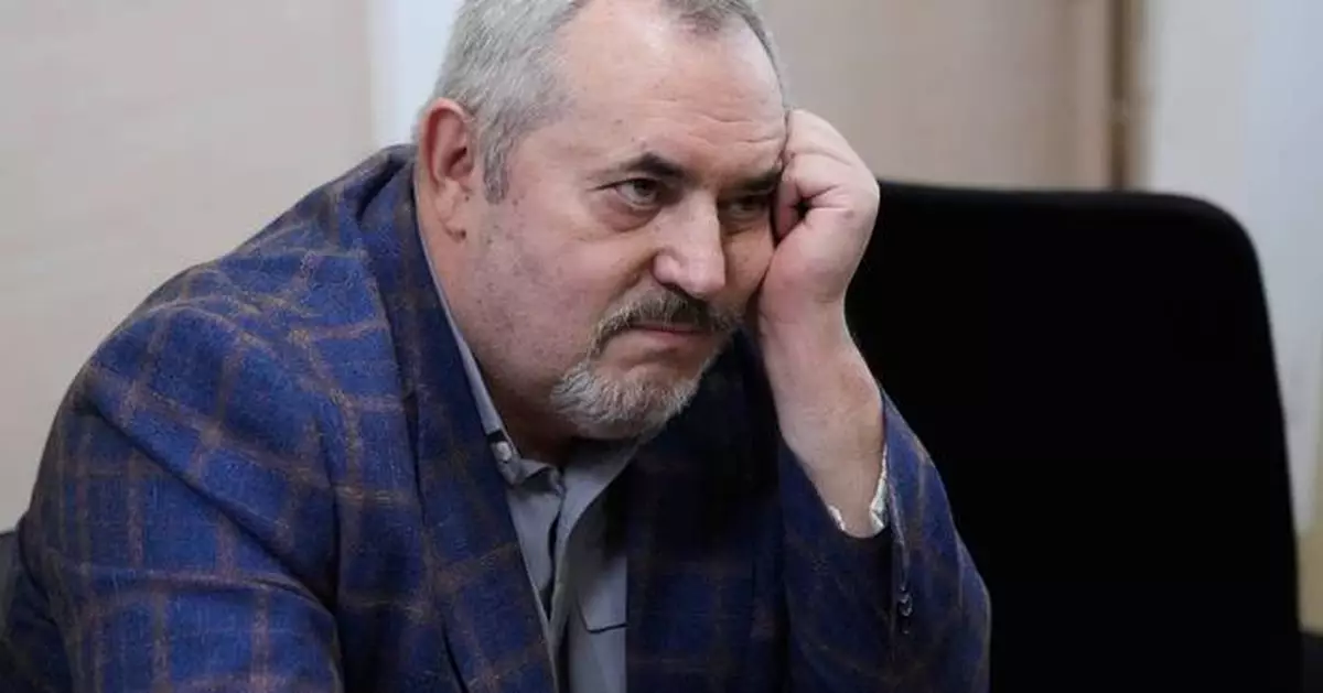 A Putin critic is convicted on charges that will keep him from campaigning for Russia's parliament