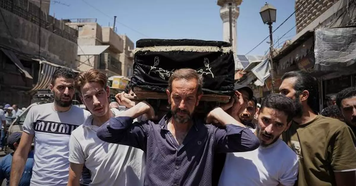 Mourners in Damascus bury cafe blast victims as officials promise justice