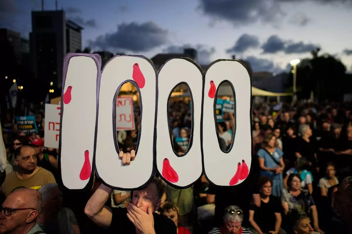 People participate in a rally marking 1,000 days to the deadly Oct. 7, 2023, Hamas-led attack on Israel, which sparked the war in Gaza, in Tel Aviv, Israel, Thursday, July 2, 2026. (AP Photo/Ohad Zwigenberg)