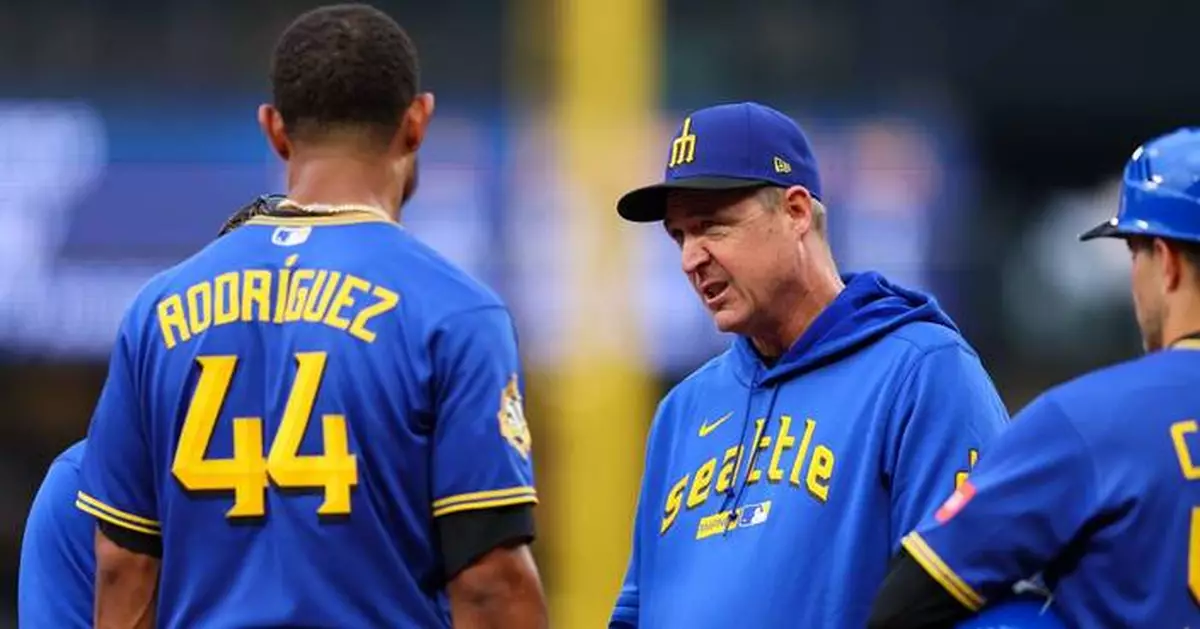 Mariners' Rodriguez removed after being hit in helmet by thrown ball