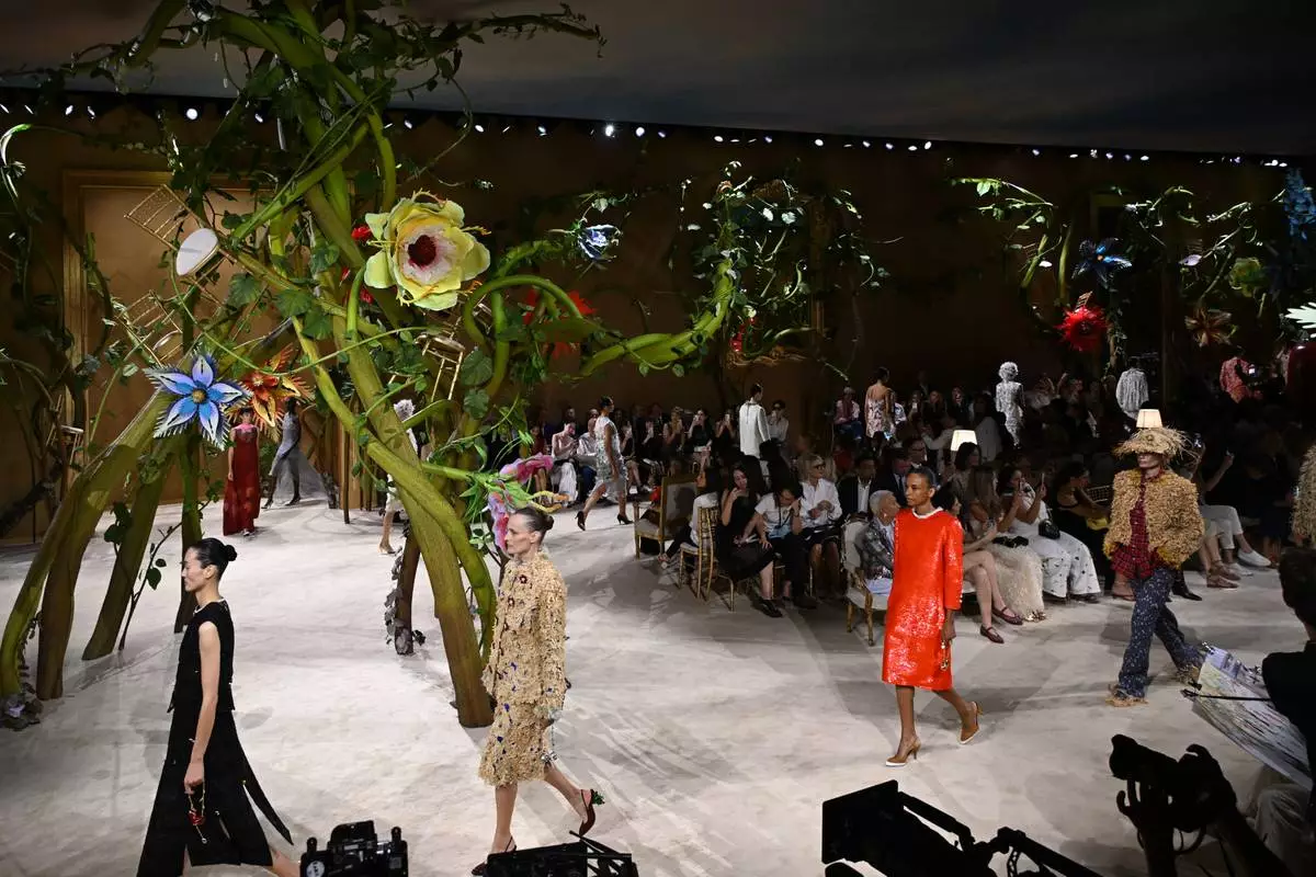 Models wear creations as part of the Chanel Haute Couture Fall/Winter 2026-2027 Women's collection presented in Paris, Tuesday, July 7, 2026. (AP Photo/Emma Da Silva)