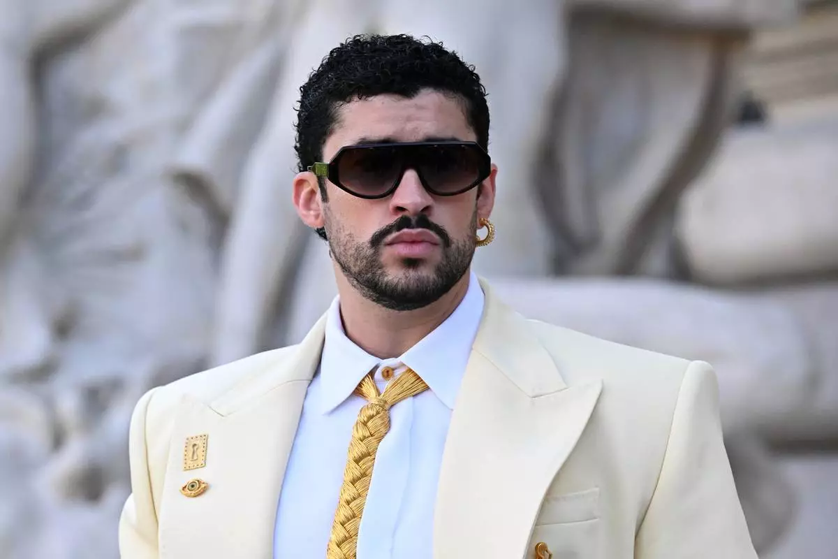 Bad Bunny arrives for the Schiaparelli Haute Couture Fall/Winter 2026-2027 Women's collection presented in Paris, Monday, July 6, 2026. (AP Photo/Emma Da Silva)