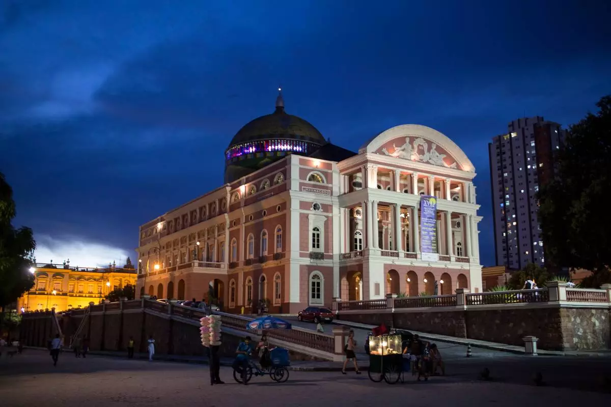 FILE - The Teatro Amazonas is visible at dusk in Manaus, Brazil, May 20, 2014. (AP Photo/Felipe Dana, File)
