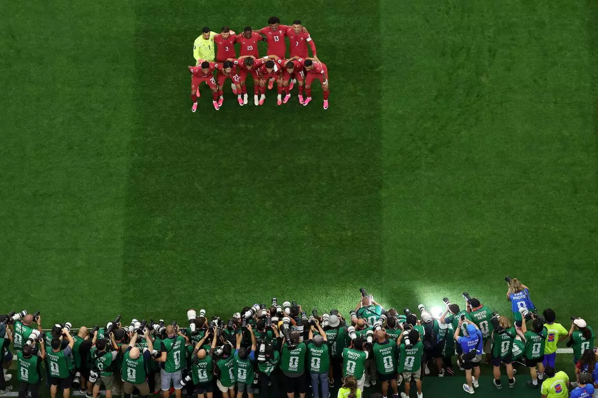Portugal players pose for a photo before a World Cup round of 16 soccer match against Spain in Arlington, Texas, near Dallas, Monday, July 6, 2026. (AP Photo/Sam Hodde)