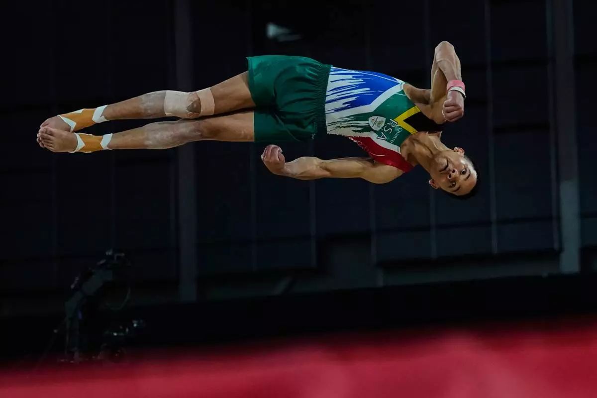 South Africa's Danile Mclean competes at the Floor Exercise during men's team final and individual qualification of Artistic Gymnastics at the Commonwealth Games in Glasgow, Scotland, Friday, July 24, 2026. (AP Photo/Manish Swarup)