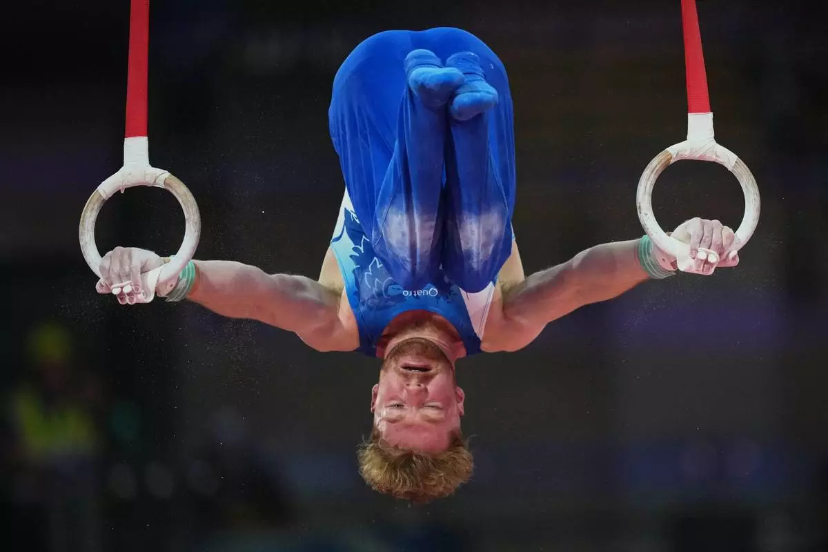 Scotland's Cameron Lynn competes at the Rings during the men's Artistic Gymnastics all-around finals at the Commonwealth Games in Glasgow, Scotland, Sunday, July 26, 2026. (AP Photo/Eranga Jayawardena)