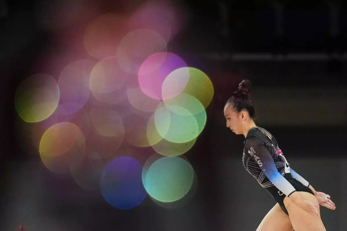 Malaysia's Yeap Kang Xian competes on the balance beam during the women's team final and individual qualification of Artistic Gymnastics at the Commonwealth Games in Glasgow, Scotland, Saturday, July 25, 2026. (AP Photo/Kin Cheung)