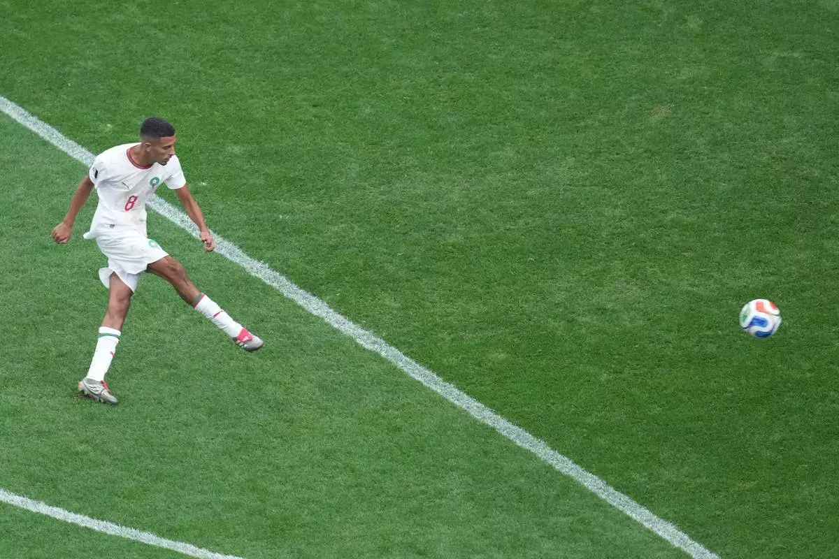 Morocco's Azzedine Ounahi (8) scores their first goal during the World Cup round of 16 soccer match between Canada and Morocco in Houston, Saturday, July 4, 2026. (AP Photo/Eric Smith