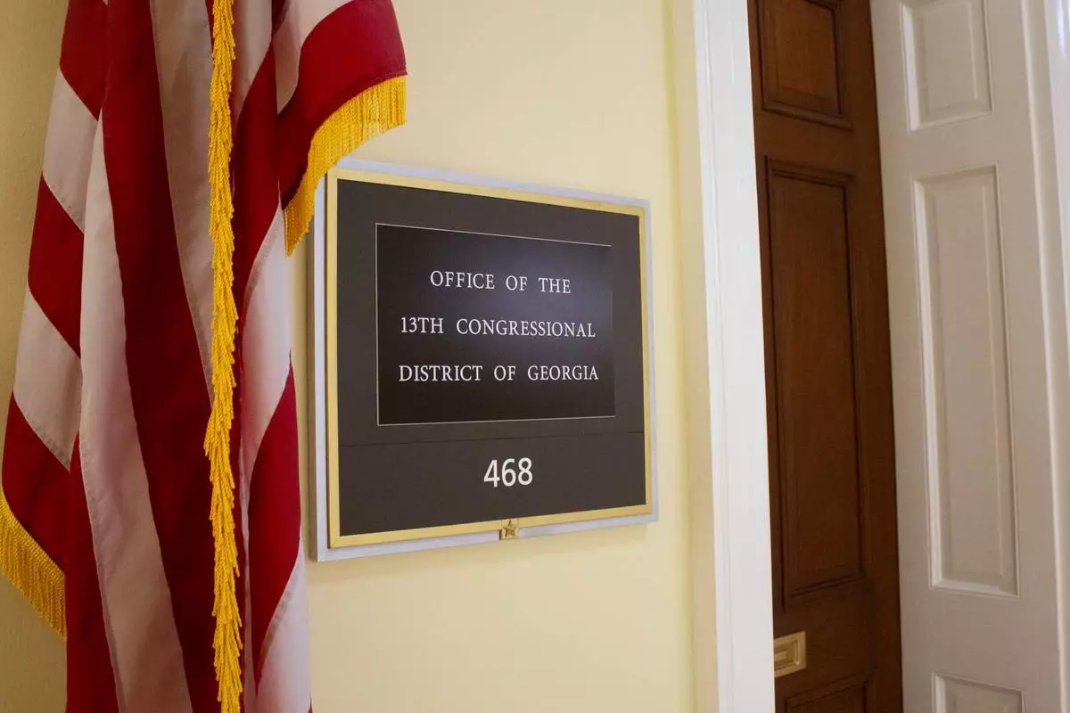 The sign for the office of the 13th Congressional District of Georgia in the Cannon House Office Building is photographed July 20, 2026, on Capitol Hill in Washington. (AP Photo/Tallulah Brown Van Zee)