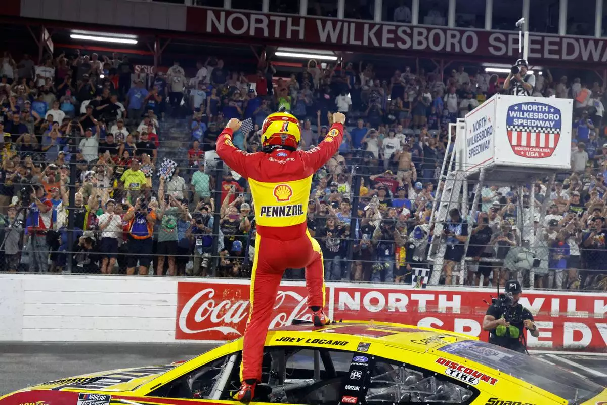 Joey Logano celebrates after winning a NASCAR Cup Series auto race in North Wilkesboro, N.C., Sunday, July 19, 2026. (AP Photo/Terry Renna)