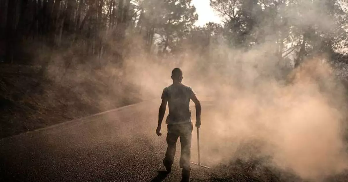 The Latest: Fire crews in southwest France battle massive blaze as they face extreme temperatures