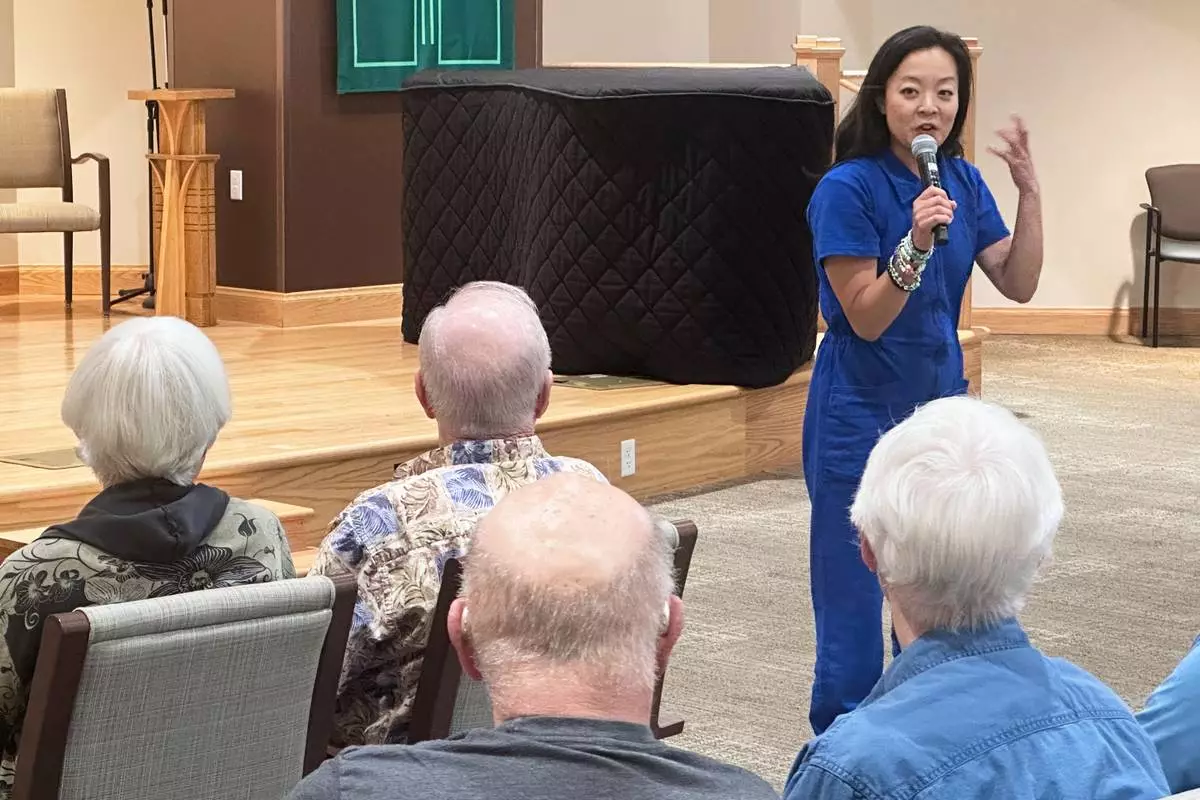 Francesca Hong, a candidate for Wisconsin governor, speaks to voters at a retirement home, Tuesday, July 7, 2026, in Madison, Wis. (AP Photo/Scott Bauer)