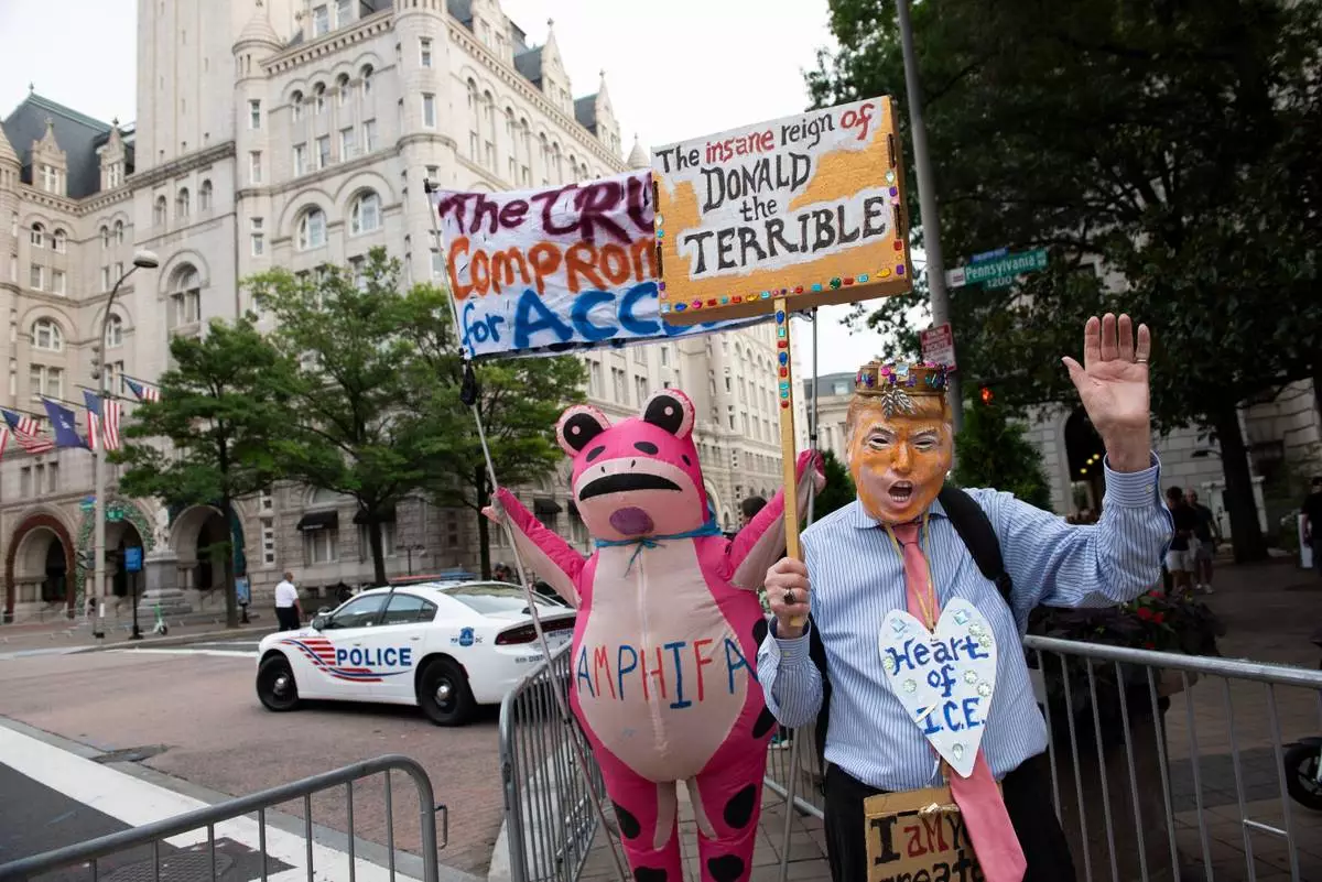 Demonstrators protest outside of the White House Correspondents' Association dinner at the Waldorf Astoria Washington DC hotel, in Washington, Friday, July 24, 2026. (AP Photo/Cliff Owen)