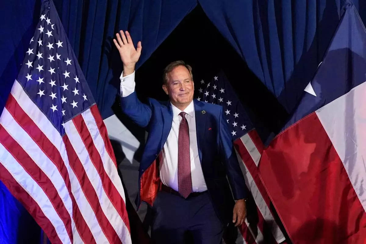 FILE - Texas Attorney General Ken Paxton, a Republican candidate for the U.S. Senate, waves as he takes the stage during a primary runoff election night event after winning the Republican party's nomination, May 26, 2026, in Plano, Texas. (AP Photo/Tony Gutierrez, File)