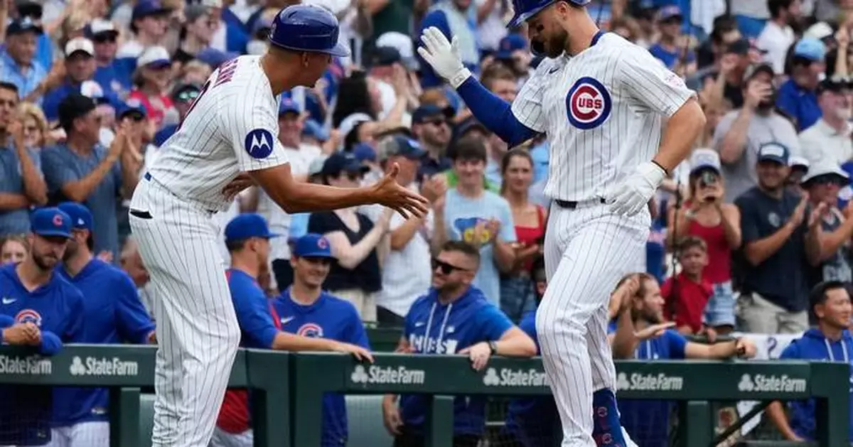 Former Cubs player Anthony Rizzo snares Michael Busch's home run ball in the Wrigley Field bleachers