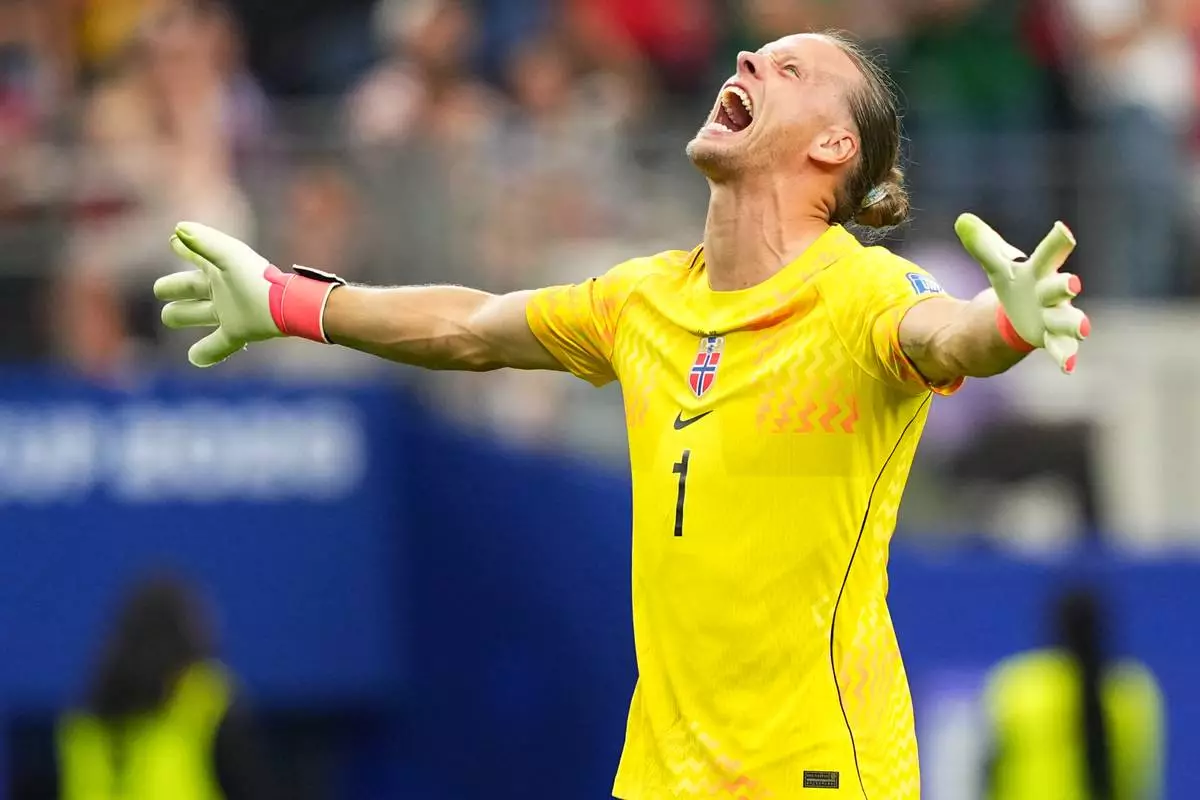 Norway goalkeeper Oerjan Nyland (1) reacts after Erling Haaland (9) scored his side's second goal during the World Cup round of 32 soccer match between Ivory Coast and Norway in Arlington, Texas, near Dallas, Tuesday, June 30, 2026. (AP Photo/Julio Cortez)
