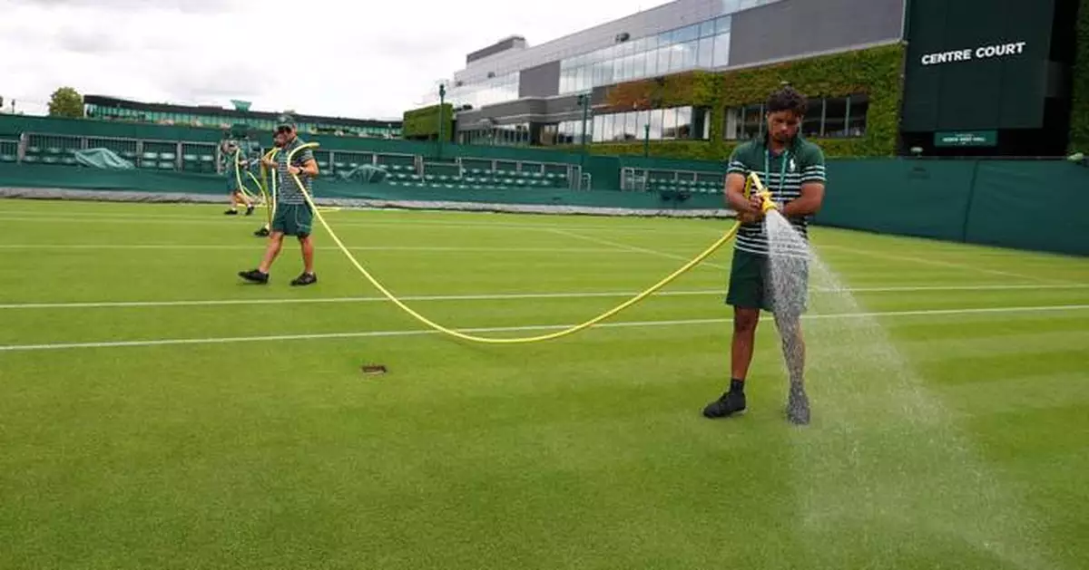 Wimbledon kept its courts lush green as other London lawns browned in record heat