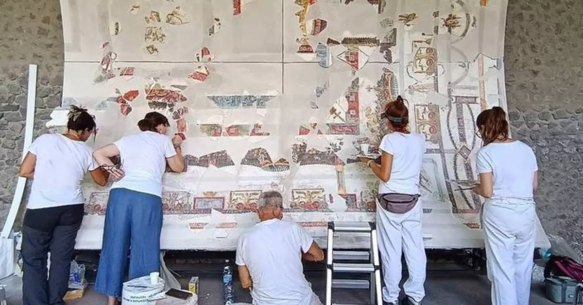 Pompeii archaeologists reconstruct frescoed ceiling of a banquet hall, with more fragments to come