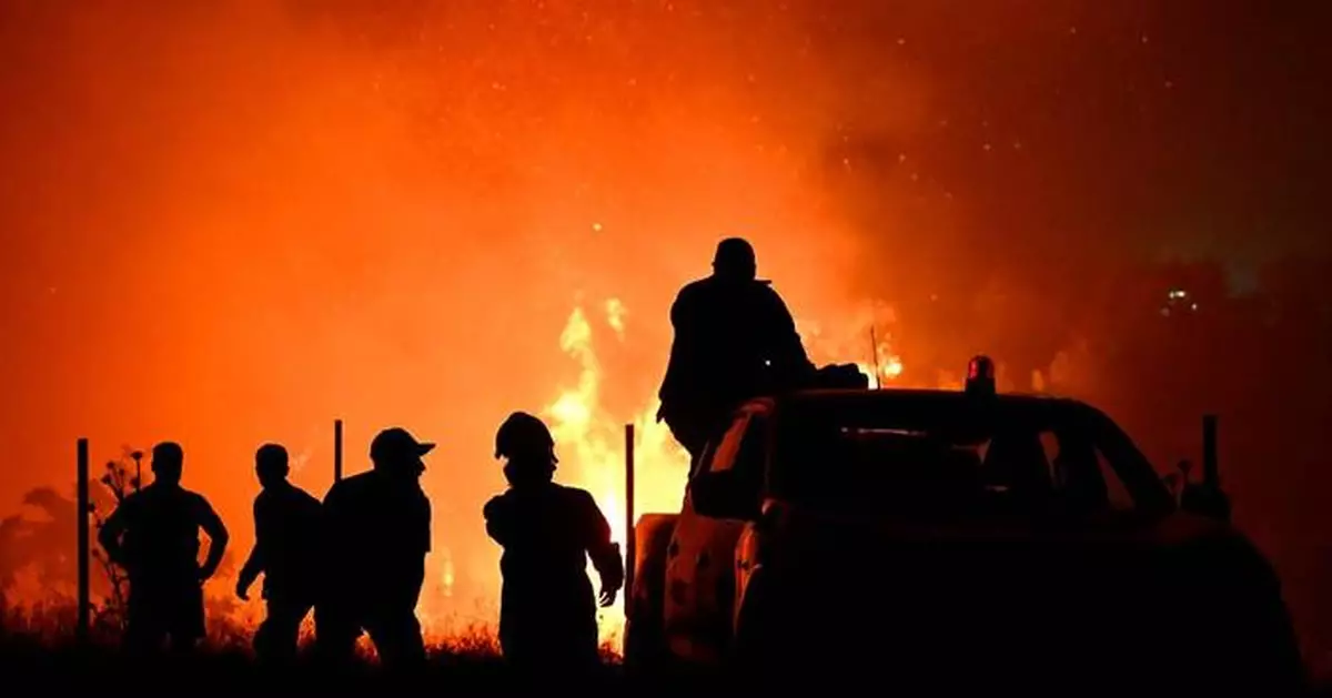 Hundreds of firefighters battle a wildfire in Portugal, while Greek authorities warn of toxic smoke