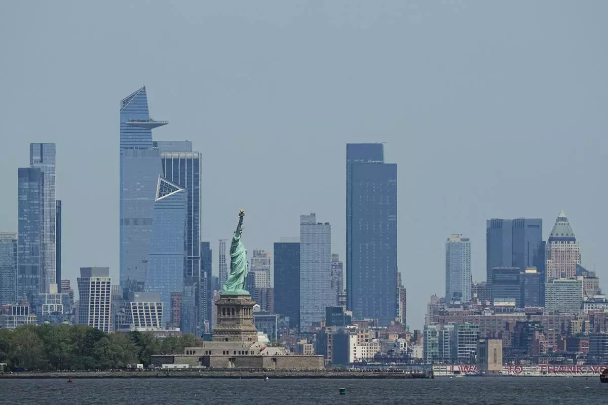 FILE - The New York skyline and Statue of Liberty are seen on May 12, 2025. (AP Photo/Matt Rourke, File)
