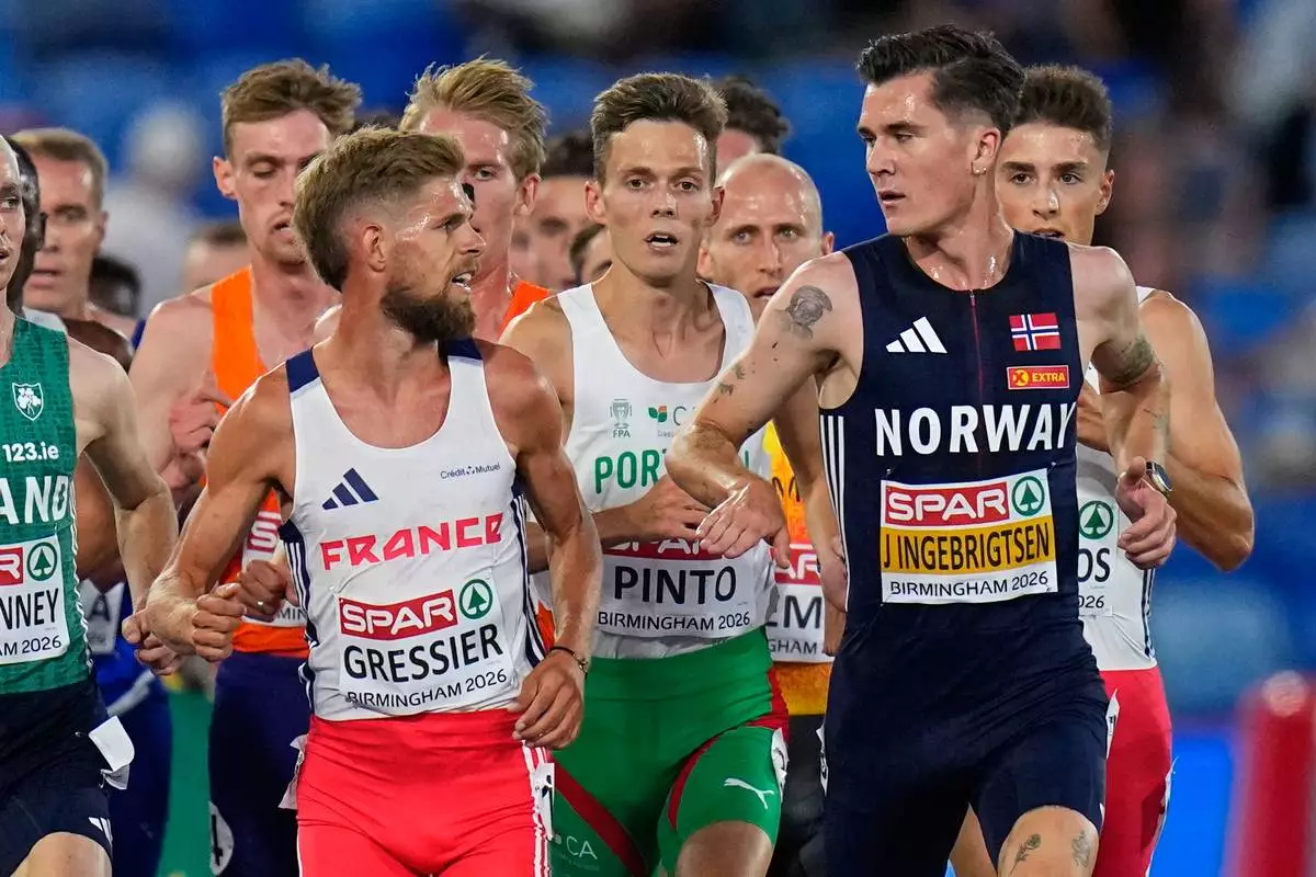 Norway's Jakob Ingebrigtsen gestures towards France's Jimmy Gressier as they race in the men's 5,000 meters final at the European Athletics Championships in Birmingham, England, Monday, Aug. 10, 2026. (AP Photo/Petr David Josek) CORRECTION: Corrects day and date.