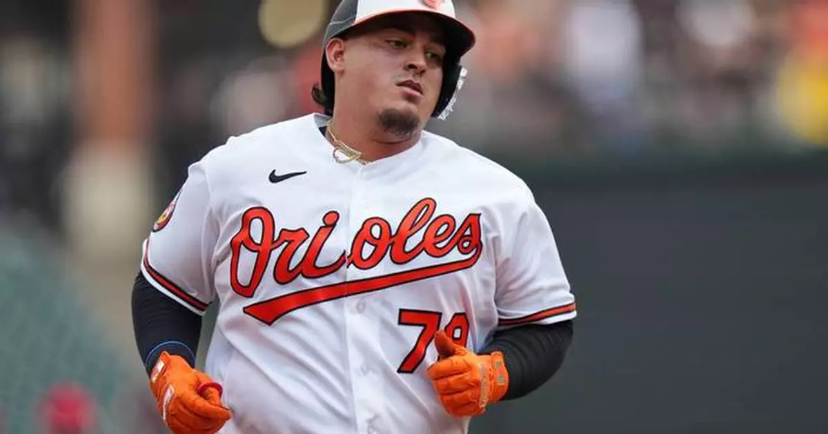 Orioles catcher Yohel Pozo gets hit in hand by Josh Bell's bat, leaves game