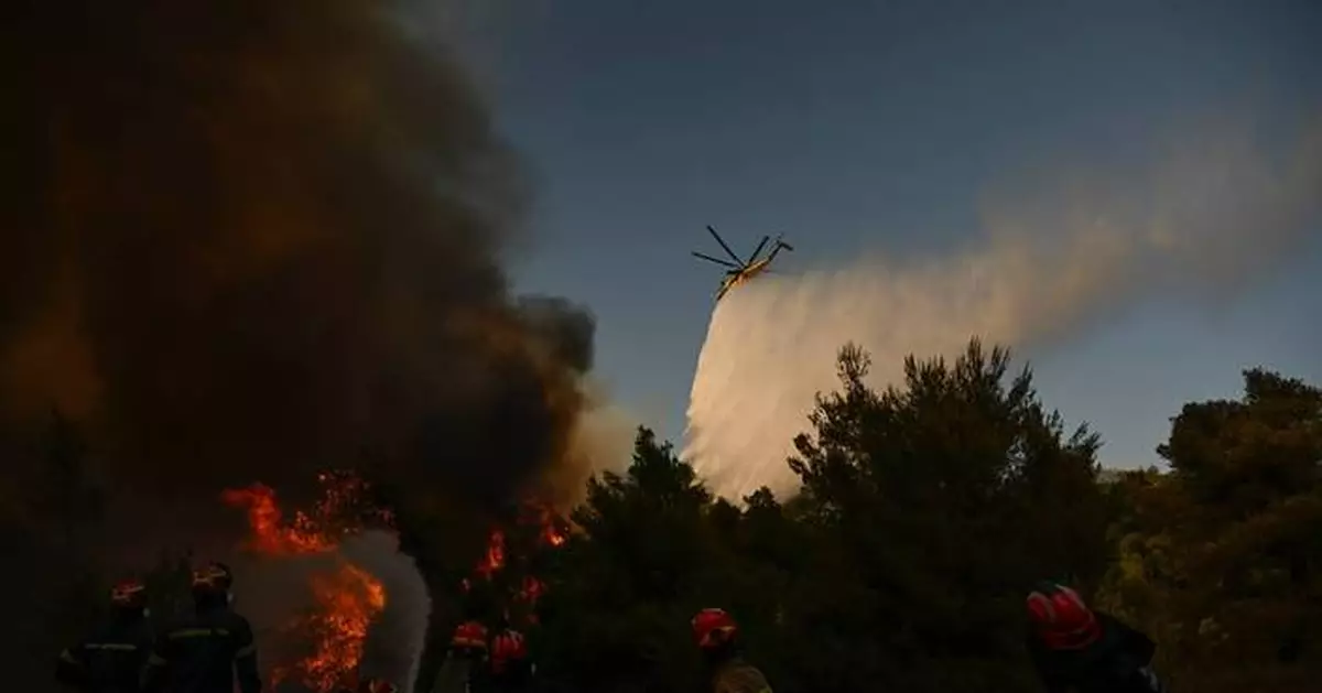 Photos show destruction from wildfires in Greece as blazes take hold in Europe and parts of the US