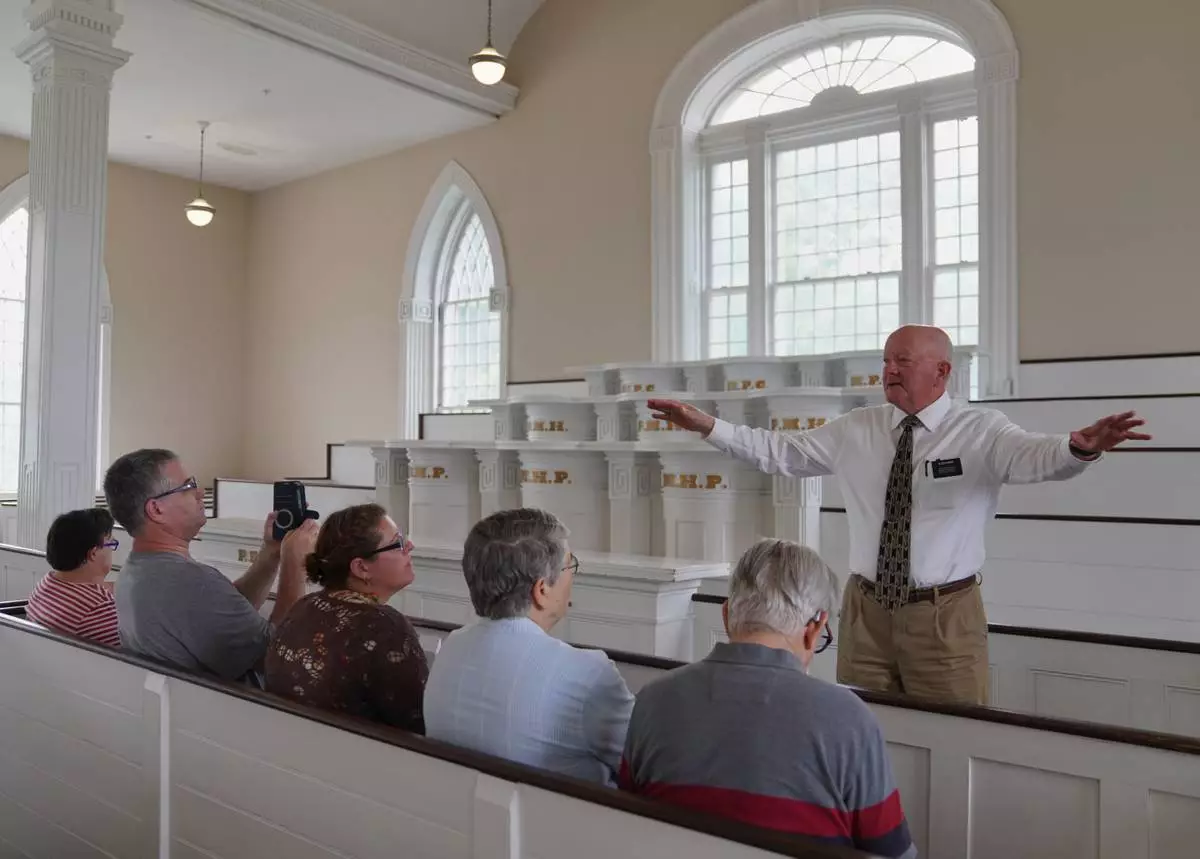 Elder Brian Garner leads a tour of the Kirtland temple site, a nearly two-century old sanctuary considered the first temple in the movement Joseph Smith founded, on Wednesday, June 15, 2026, in Kirtland, Ohio. (AP Photo/Jessie Wardarski)