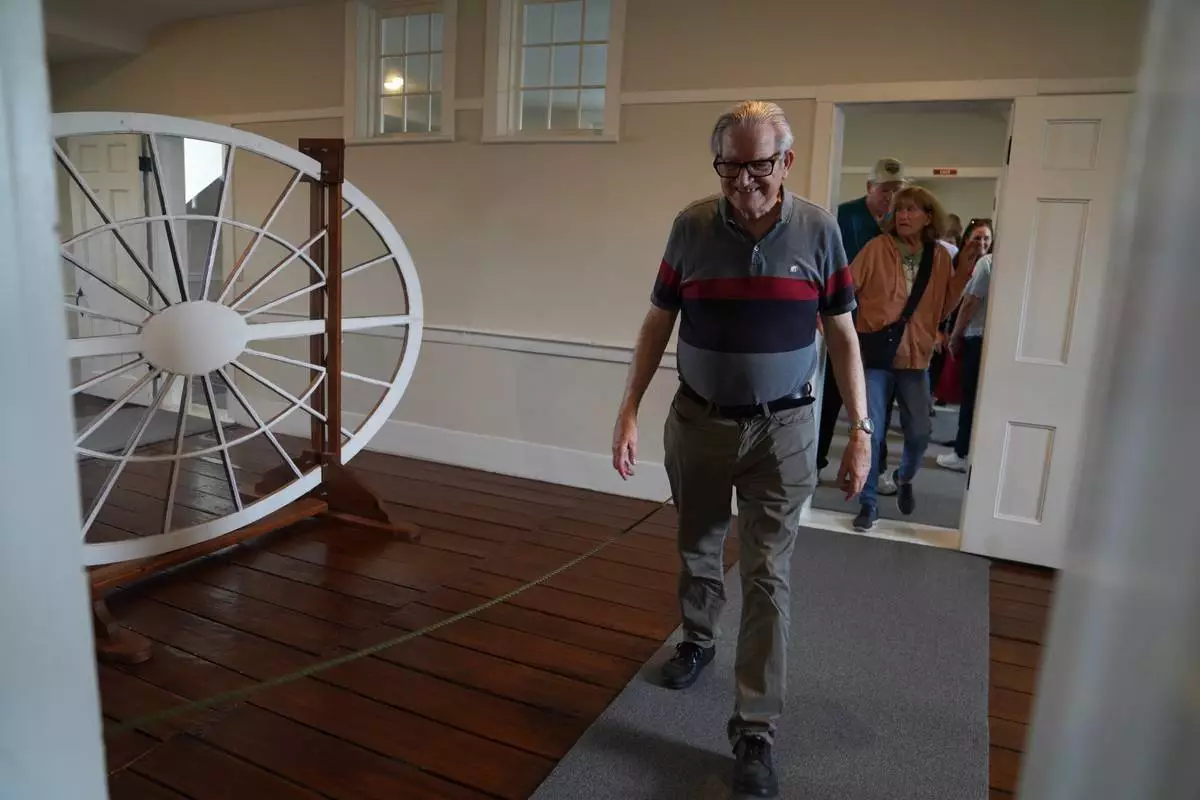 Visitors from around the country tour the third floor of the Kirtland temple, a nearly two-century old sanctuary considered the first temple in the movement Joseph Smith founded, on Wednesday, June 15, 2026, in Kirtland, Ohio. (AP Photo/Jessie Wardarski)