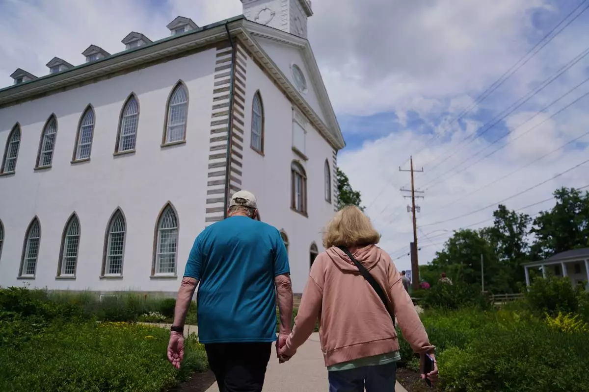 Tourists visit the Kirtland temple site, a nearly two-century old sanctuary considered the first temple in the movement Joseph Smith founded, on Wednesday, June 15, 2026, in Kirtland, Ohio. (AP Photo/Jessie Wardarski)