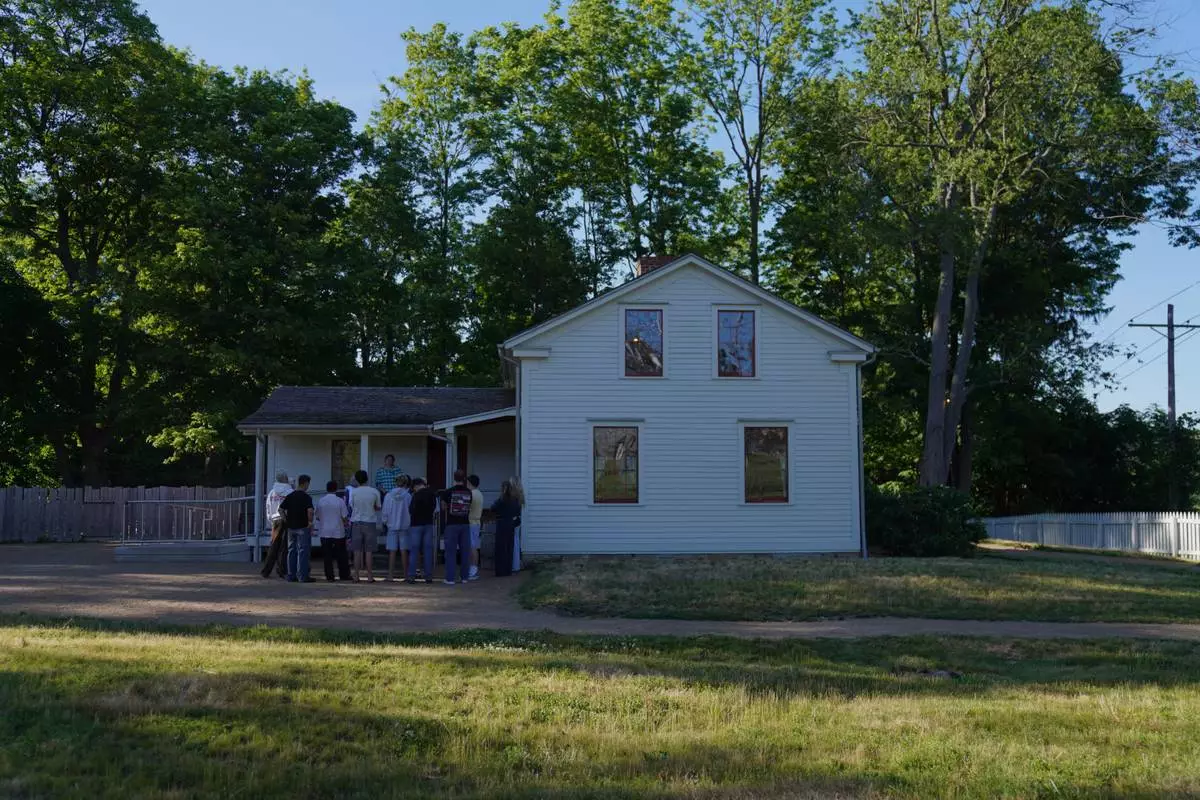 Visitors tour the Joseph and Emma Smith home while at the adjacent Kirtland temple site, on Wednesday, June 15, 2026, in Kirtland, Ohio. (AP Photo/Jessie Wardarski)