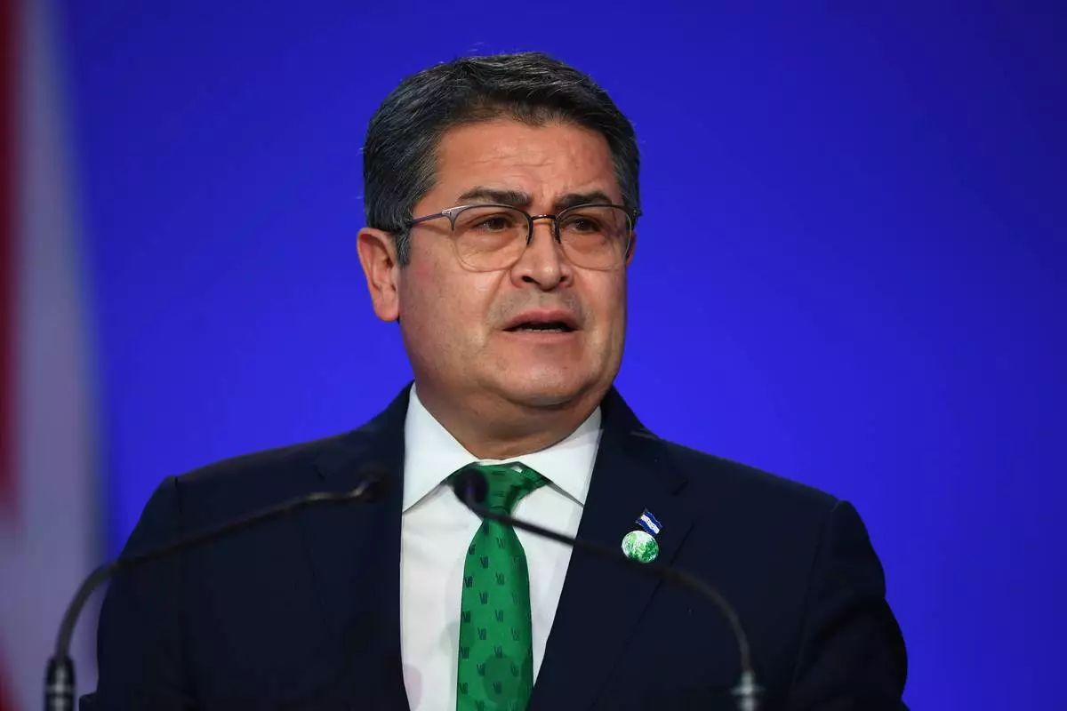 FILE - Honduras' President Juan Orlando Hernandez speaks during the opening ceremony of the UN Climate Change Conference COP26 in Glasgow, Scotland, Monday Nov. 1, 2021. (Andy Buchanan/Pool via AP, File)