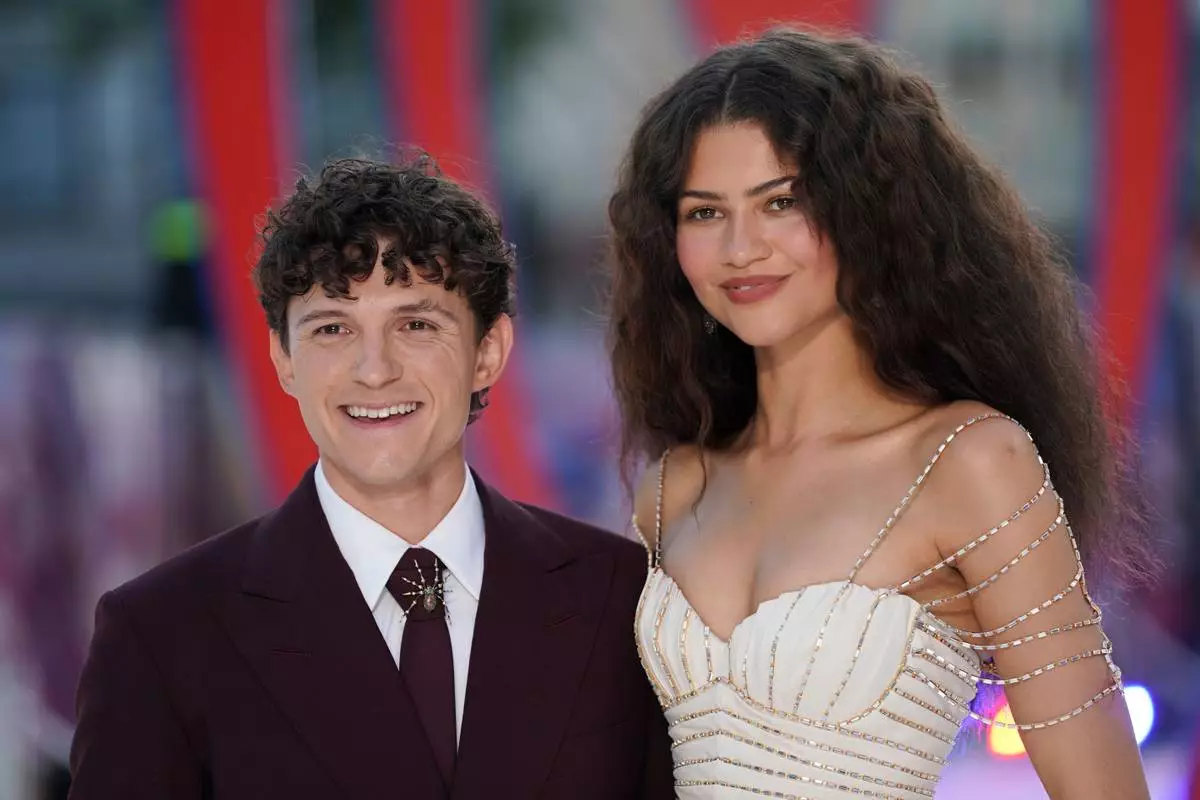 Tom Holland and Zendaya pose for photographers upon arrival at the Spider-Man: Brand New Day premiere in London, England, Wednesday, July 29, 2026. (Photo by Alberto Pezzali/Invision/AP)