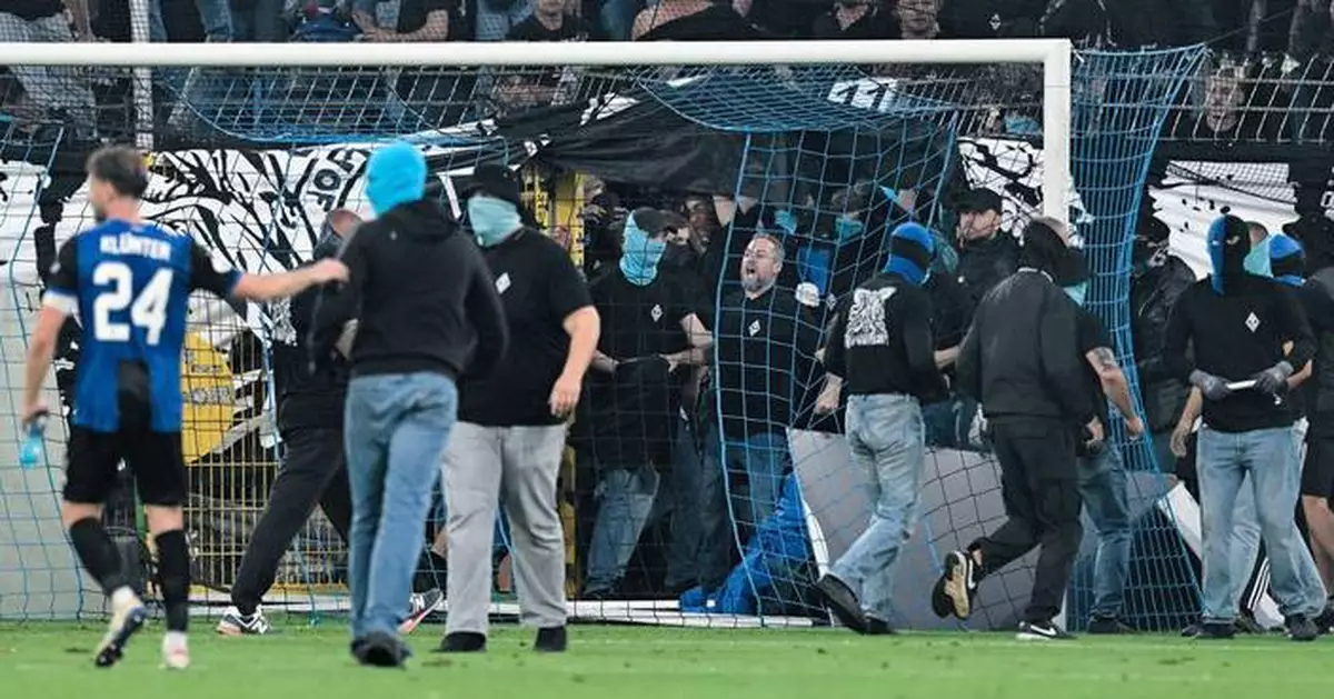 German Cup match marred by fireworks, pitch invasion
