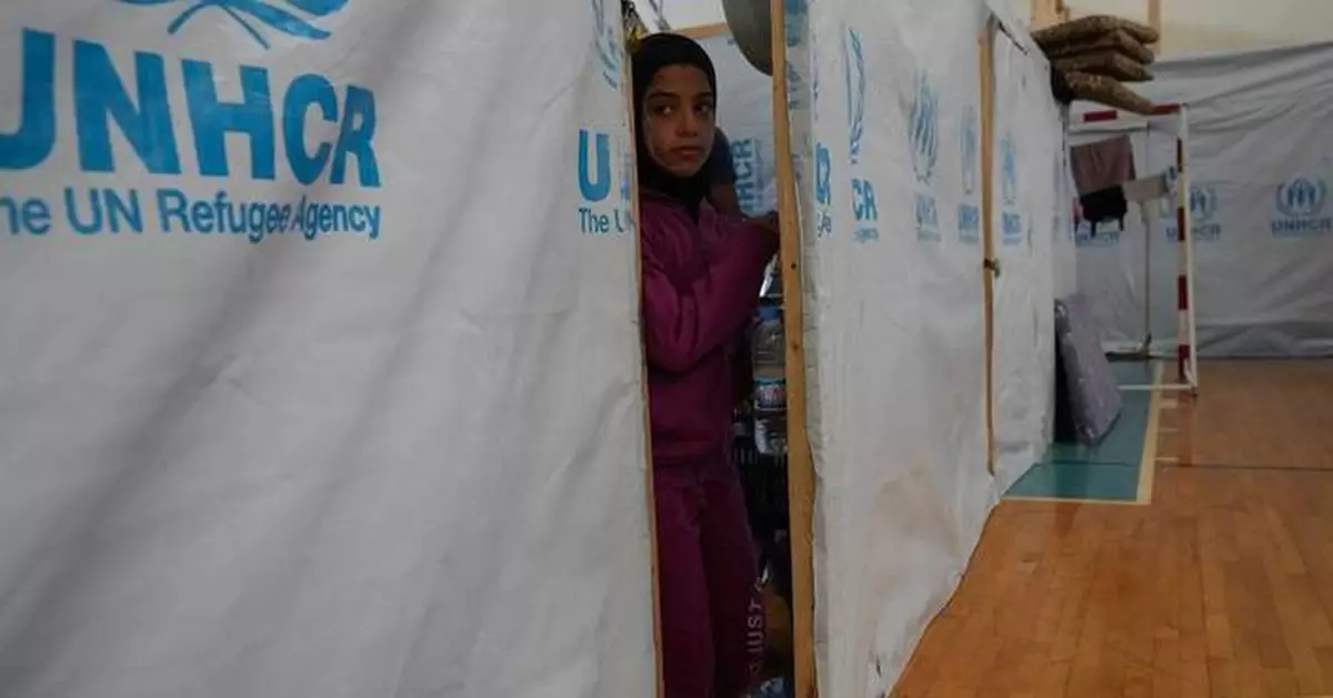 A basketball court shelters displaced families in Lebanon, in photos