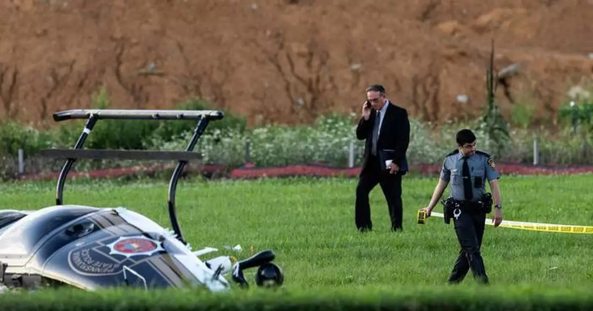 Investigators probe a dramatic midair crash as a landing plane hits  hovering police helicopter