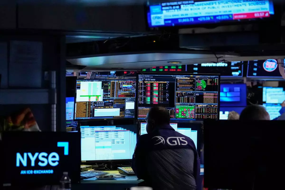Specialist Dilip Patel works on the floor of the New York Stock Exchange, Thursday, July 30, 2026, in New York. (AP Photo/Yuki Iwamura)